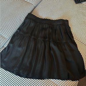 A mini satin skirt with pockets brand brand new never worn. Adorable